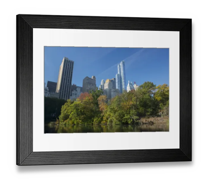 Framed Print : View of highrise buildings along Central Park South from inside Central Park on a sunny Fall day