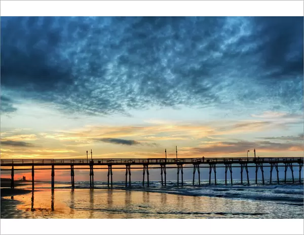 USA, North Carolina. Sunset Beach pier at sunrise