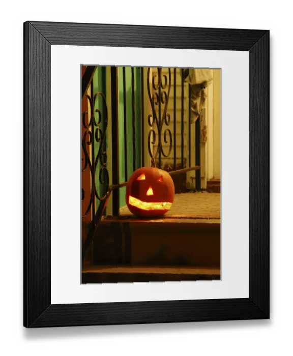 Framed Print : USA, Oregon, Portland. Lighted jack-o-lantern on front porch awaiting trick or treaters Framed Print : USA, Oregon, Portland. Lighted jack-o-lantern on front porch awaiting trick or treaters
