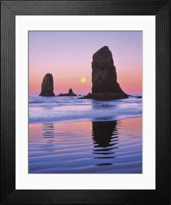 Framed Print : USA, Oregon, Cannon Beach. The Needles rock monoliths at sunrise showing moon at moonset Framed Print : USA, Oregon, Cannon Beach. The Needles rock monoliths at sunrise showing moon at moonset