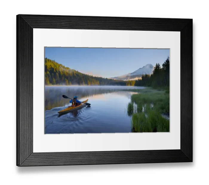 Framed Print : USA, Oregon. A woman in a sea kayak paddles on Trillium Lake, Oregon, in the Oregon Cascades