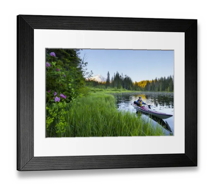 Framed Print : USA, Oregon. A woman in a sea kayak paddles on Trillium Lake, Oregon, in the Oregon Cascades