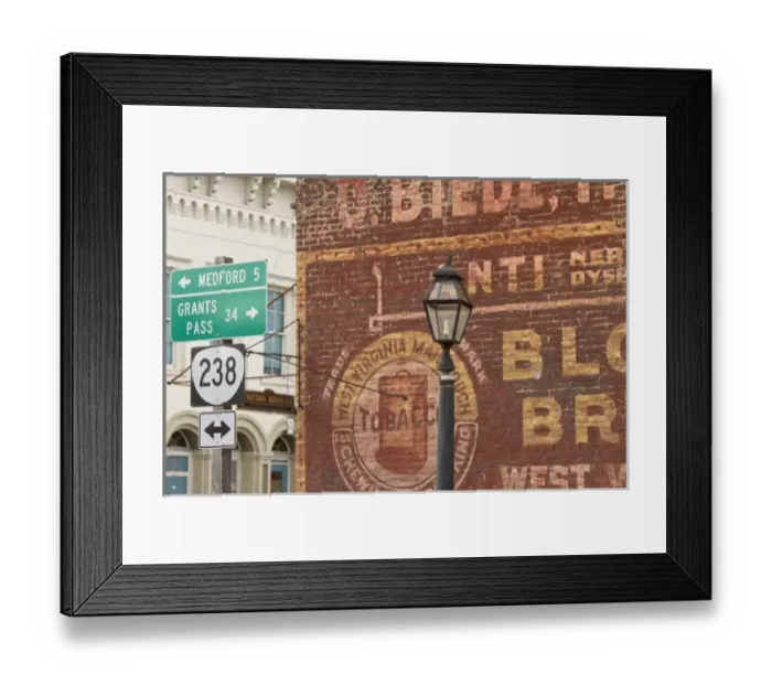Framed Print : Advertisements on side of building in historic Jacksonville, Oregon