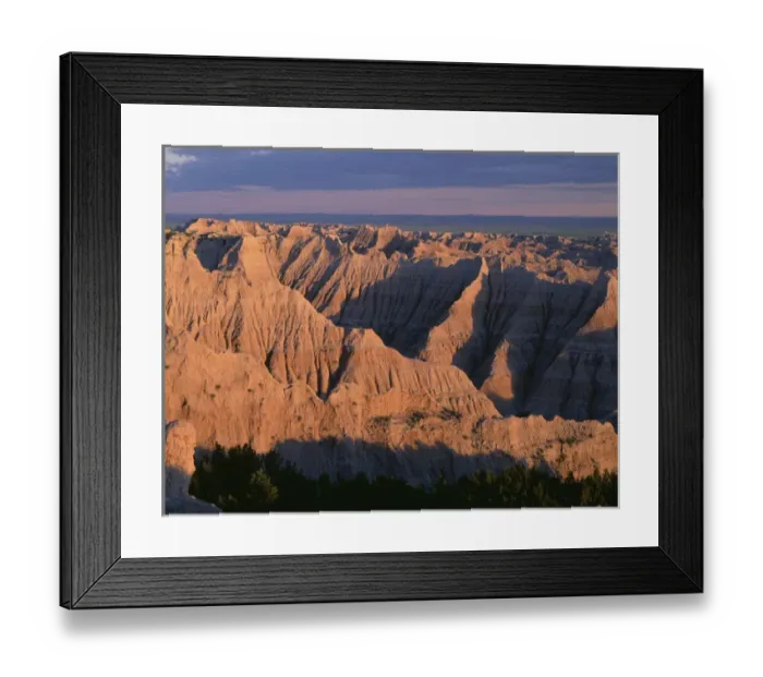 Framed Print : USA, South Dakota, Badlands National Park, North Unit, Sunset light on expansive area of eroded