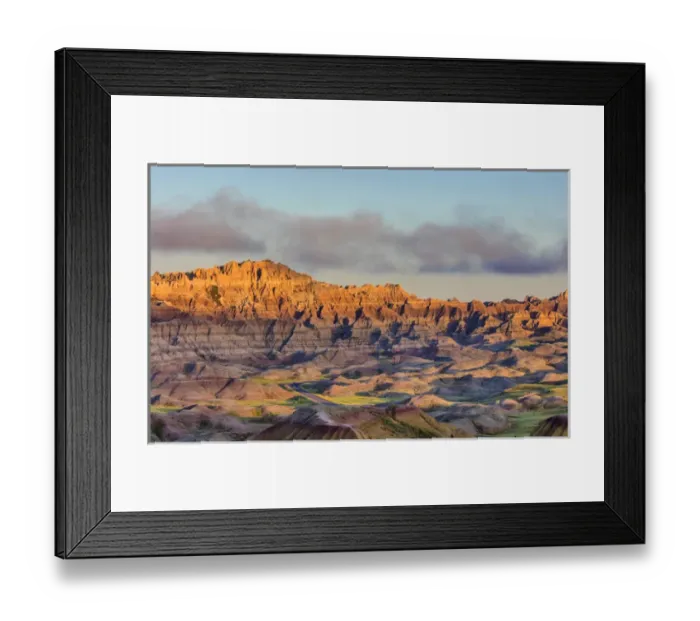 Framed Print : Sunrise light breaks through on a foggy morning in Badlands National Park, South Dakota Framed Print : Sunrise light breaks through on a foggy morning in Badlands National Park, South Dakota