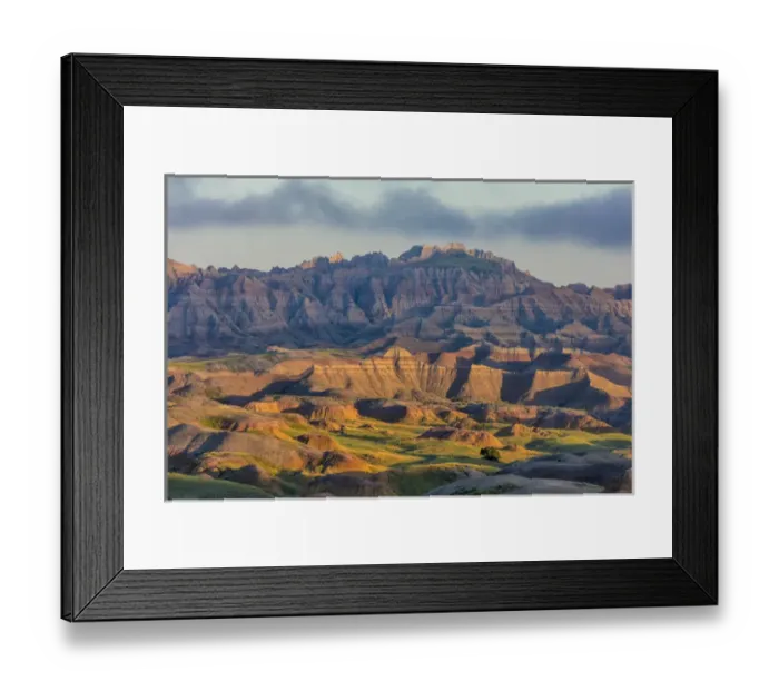 Framed Print : Sunrise light breaks through on a foggy morning in Badlands National Park, South Dakota Framed Print : Sunrise light breaks through on a foggy morning in Badlands National Park, South Dakota