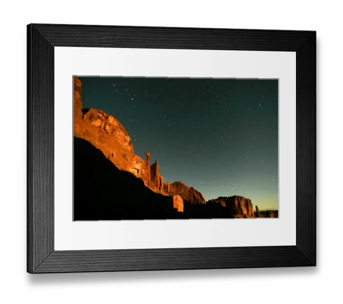 Framed Print : USA, Utah, Arches National Park. Moonrise highlights Park Avenue, with star points