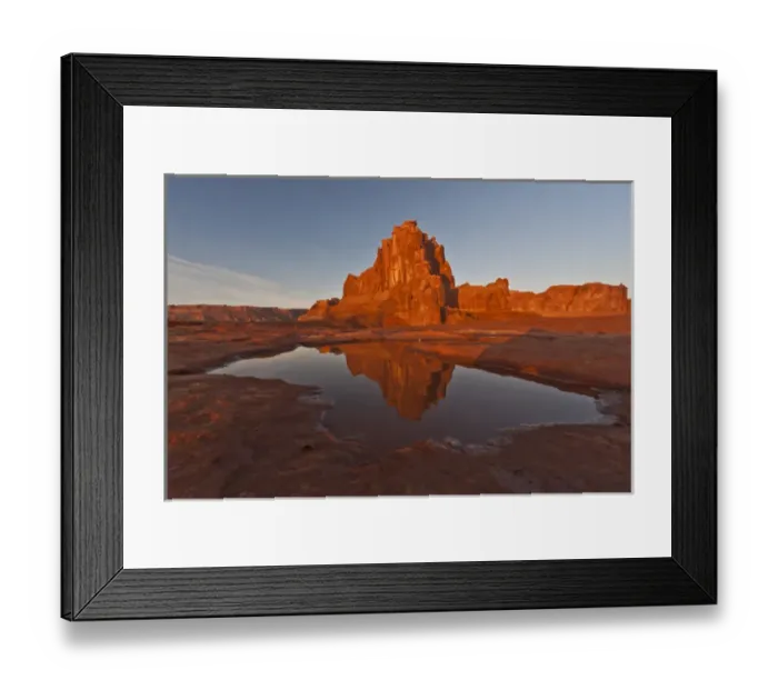 Framed Print : USA, Utah, Arches National Park, La Sal Overlook. Rock formation reflected in rain puddle
