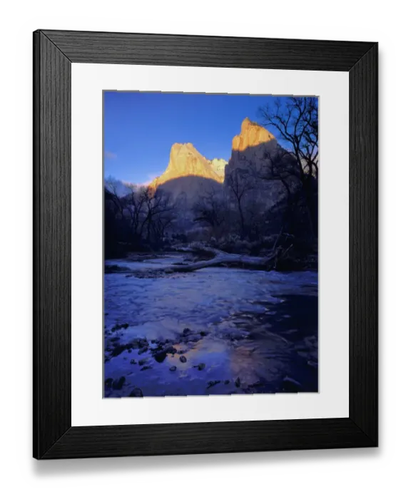 Framed Print : Zion National Park, Utah. USA. Light of sunrise on towers of Zion Canyon above Virgin