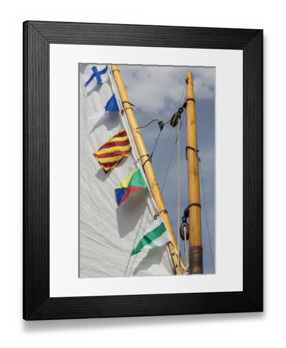 Framed Print : USA, Washington. Boat sail and flags at Bainbridge Island Wooden Boat Festival. Credit as