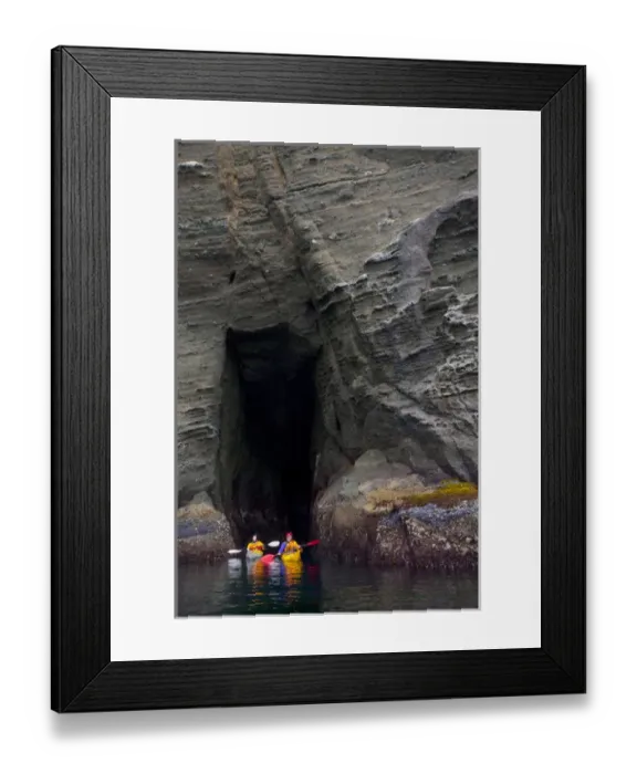 Framed Print : USA. Washington state. Man and woman sea kayakers explore a sea cave at Cape Flattery Framed Print : USA. Washington state. Man and woman sea kayakers explore a sea cave at Cape Flattery