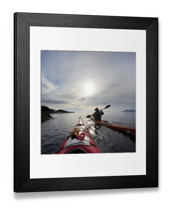 Framed Print : USA, Washington state, San Juan Islands. Sea kayakers paddle along the shore of Rosario