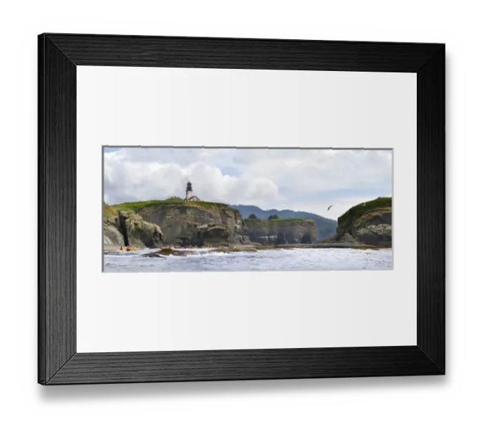 Framed Print : USA. Washington state. Sea Kayakers paddle beneath the lighthouse on Tatoosh Island