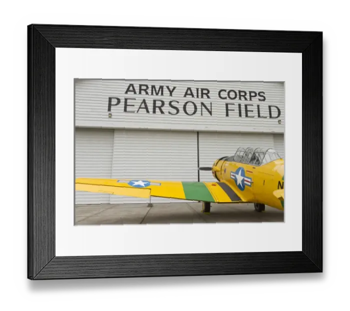 Framed Print : A vintage World War II military trainer aircraft parked at a hangar at Pearson Field