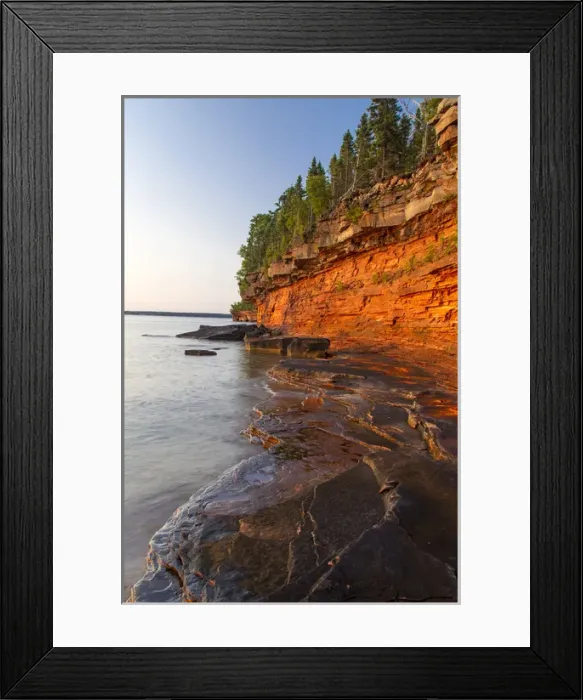Framed Print : Layered sandstone cliffs and sea caves at sunrise on Devils Island in the Apostle Framed Print : Layered sandstone cliffs and sea caves at sunrise on Devils Island in the Apostle