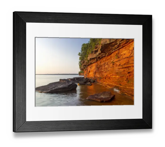 Framed Print : Layered sandstone cliffs and sea caves at sunrise on Devils Island in the Apostle Framed Print : Layered sandstone cliffs and sea caves at sunrise on Devils Island in the Apostle