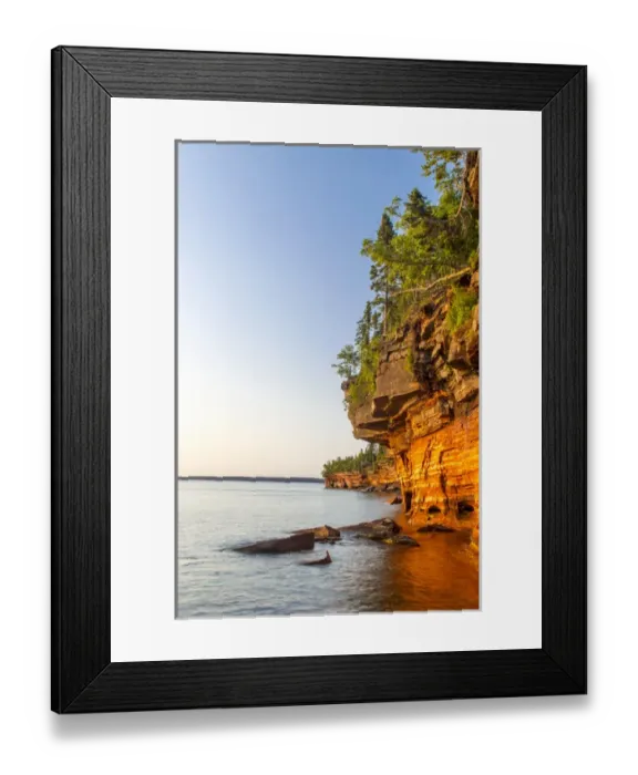 Framed Print : Layered sandstone cliffs and sea caves at sunrise on Devils Island in the Apostle Framed Print : Layered sandstone cliffs and sea caves at sunrise on Devils Island in the Apostle