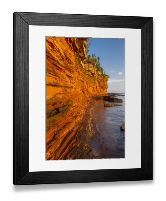 Framed Print : Layered sandstone cliffs and sea caves at sunrise on Devils Island in the Apostle Framed Print : Layered sandstone cliffs and sea caves at sunrise on Devils Island in the Apostle