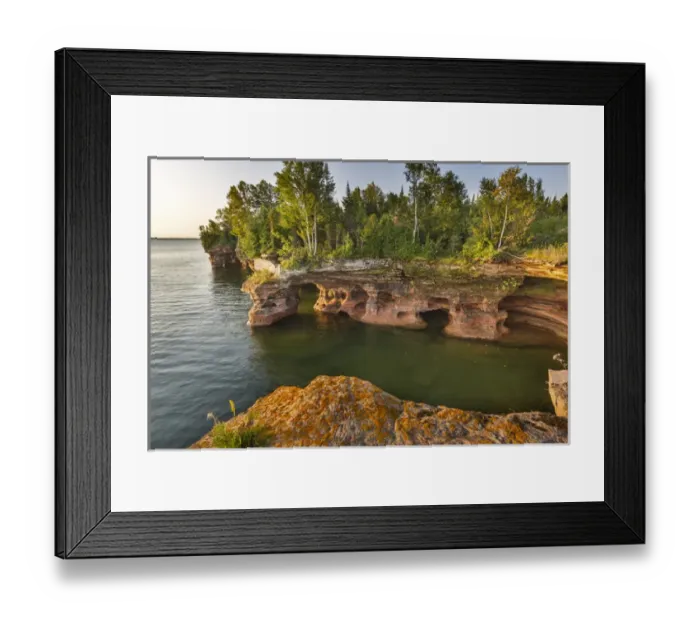 Framed Print : Layered sandstone cliffs and sea caves at sunrise on Devils Island in the Apostle Framed Print : Layered sandstone cliffs and sea caves at sunrise on Devils Island in the Apostle