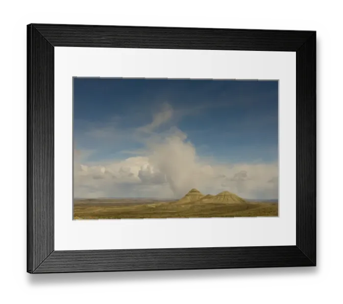 Framed Print : Sandstone Buttes (Badlands) Uinta County near Interstate 80, Wyoming. Low hanging Cumulus Clouds Framed Print : Sandstone Buttes (Badlands) Uinta County near Interstate 80, Wyoming. Low hanging Cumulus Clouds