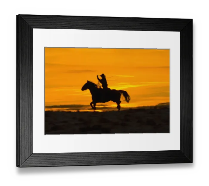 Framed Print : North America; USA; Wyoming; Shell; Cowboy riding in the Sunset with lariat Rope; (MR)