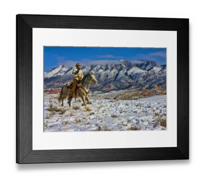 Framed Print : North America; USA; Wyoming; Shell; Cowboy riding Horse through the Snow; Model Released Framed Print : North America; USA; Wyoming; Shell; Cowboy riding Horse through the Snow; Model Released