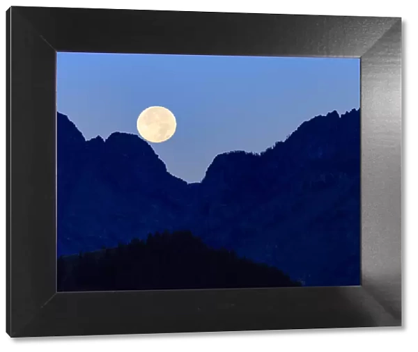 Super moon setting over the Grand Teton Mountain Range, Grand Teton National Park