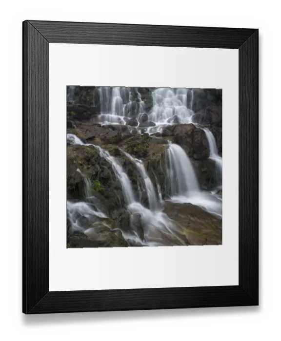 Framed Print : Waterfall near Fuglafjordur. The island Eysturoy one of the two large islands of Framed Print : Waterfall near Fuglafjordur. The island Eysturoy one of the two large islands of