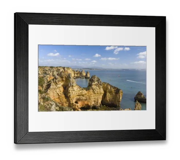 Framed Print : The cliffs and sea stacks of Ponta da Piedade at the rocky coast of the Algarve in Portugal Framed Print : The cliffs and sea stacks of Ponta da Piedade at the rocky coast of the Algarve in Portugal