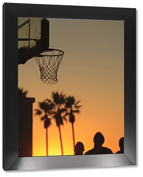 Sunset scenes near Venice Beach, Southern CA, USA. Outdoor basketball court