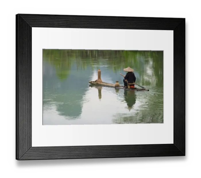Framed Print : Fisherman on bamboo raft on Mingshi River with karst hills, Mingshi, Guangxi Province