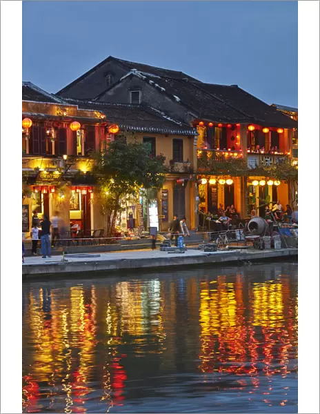 Restaurants reflected in Thu Bon River at dusk, Hoi An (UNESCO World Heritage Site)