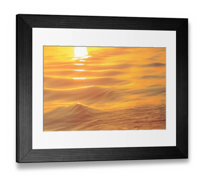Framed Print : Sunset colors and patterns on small waves in water