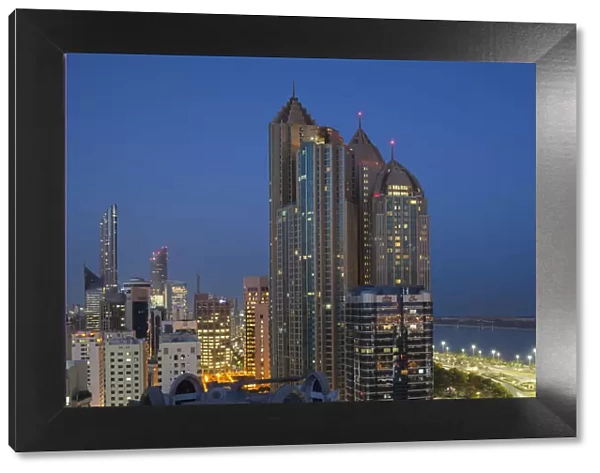 UAE, Abu Dhabi, elevated skyline from Corniche Road East, dawn