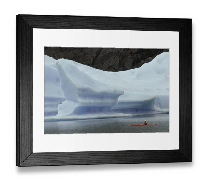 Framed Print : Kayakers exploring Grey Lake amid large iceberg, Torres del Paine National Park
