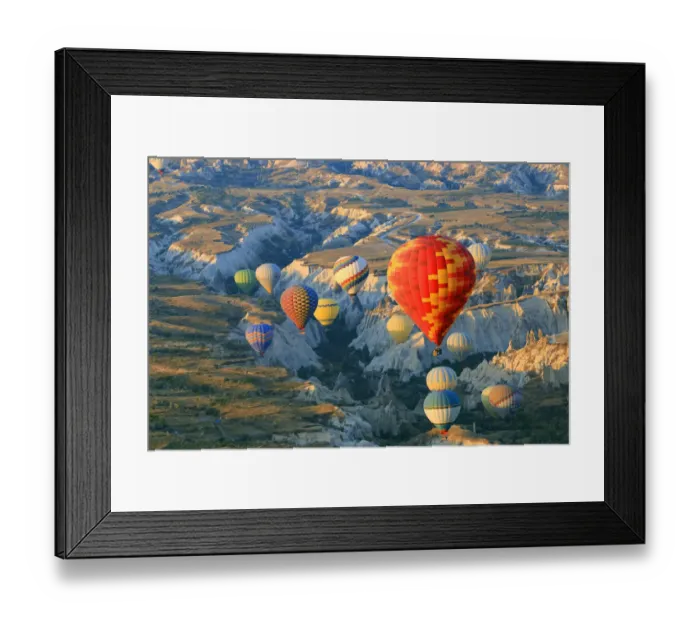 Framed Print : Turkey, Anatolia, Cappadocia, Goreme. Hot air balloons flying above  /  among rock formations