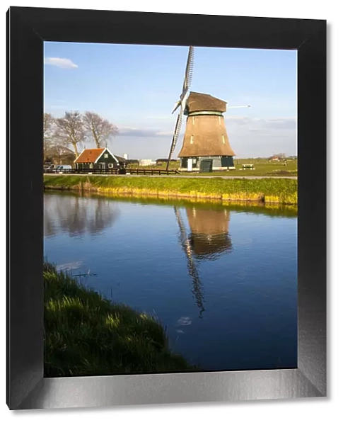 Netherlands, Lisse, Windmill on a Canal