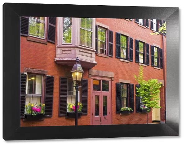 Brick houses and gas street lamp on Beacon Hill, Boston, Massachusetts USA