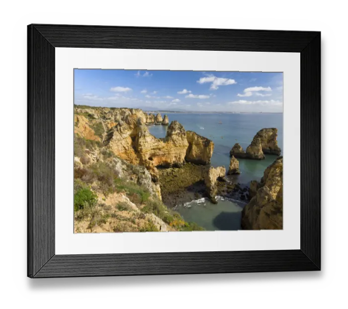 Framed Print : The cliffs and sea stacks of Ponta da Piedade at the rocky coast of the Algarve in Portugal Framed Print : The cliffs and sea stacks of Ponta da Piedade at the rocky coast of the Algarve in Portugal
