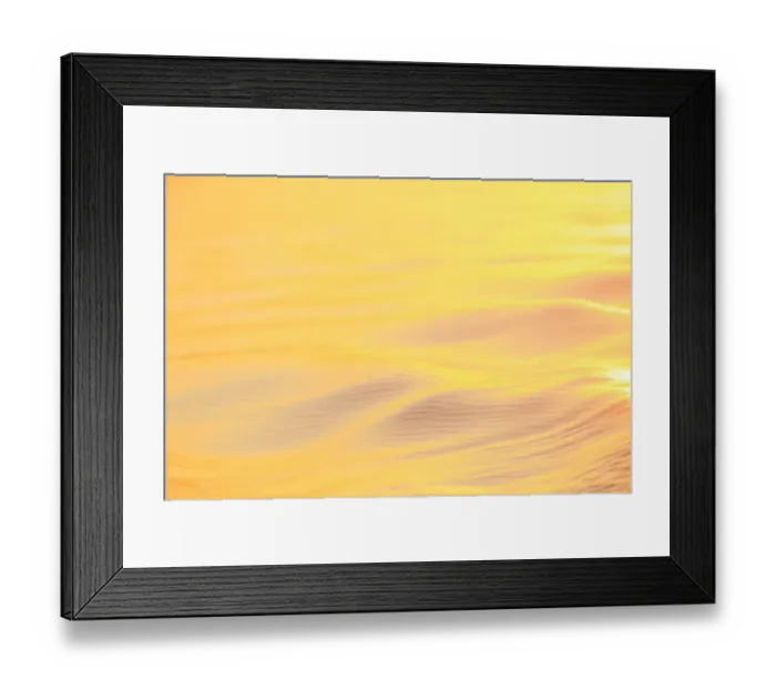 Framed Print : Sunset colors and patterns on small waves in water