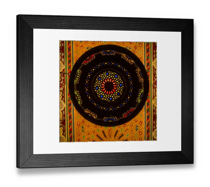 Framed Print : Morocco. A graphic silhouetted detail of a metal Moroccan lamp in a ceiling of a Framed Print : Morocco. A graphic silhouetted detail of a metal Moroccan lamp in a ceiling of a