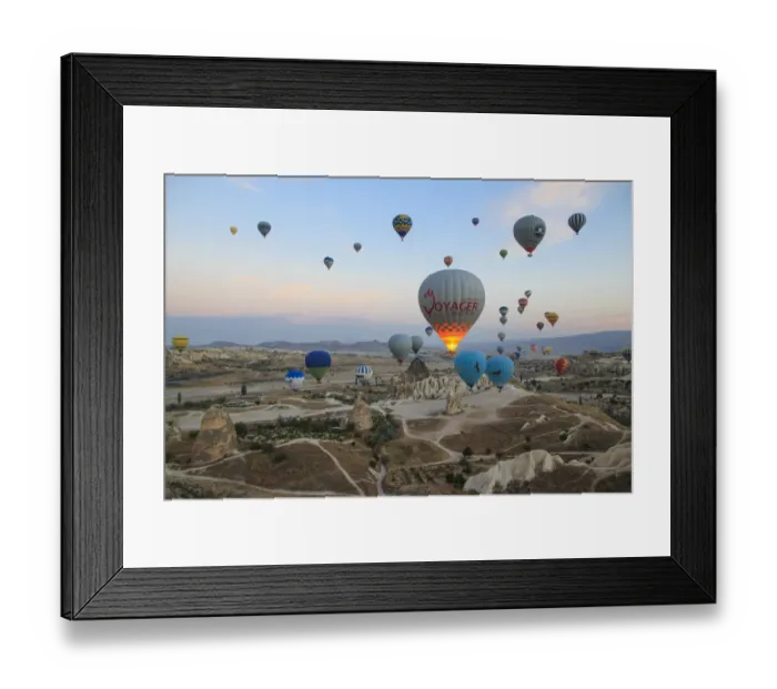 Framed Print : Turkey, Anatolia, Cappadocia, Goreme. Hot air balloons flying above  /  among rock formations