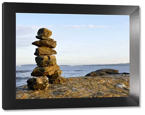 Canada, British Columbia, Russell Island. Rock inukshuk in front of Salt Spring Island