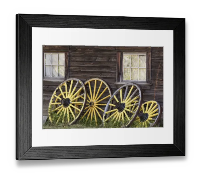 Framed Print : Canada, British Columbia, Barkerville. Wagon wheels lean on old building. Credit as Framed Print : Canada, British Columbia, Barkerville. Wagon wheels lean on old building. Credit as