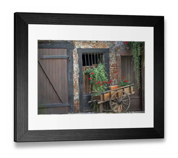 Framed Print : Europe; France; Alsace province; Colmar. Rustic wooden wagon in front of brick building Framed Print : Europe; France; Alsace province; Colmar. Rustic wooden wagon in front of brick building