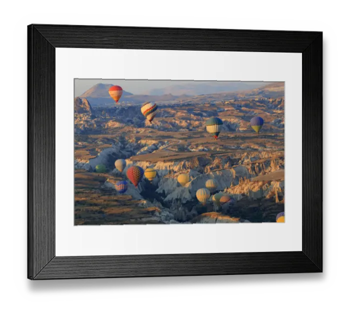 Framed Print : Turkey, Anatolia, Cappadocia, Goreme. Hot air balloons flying above  /  among rock formations