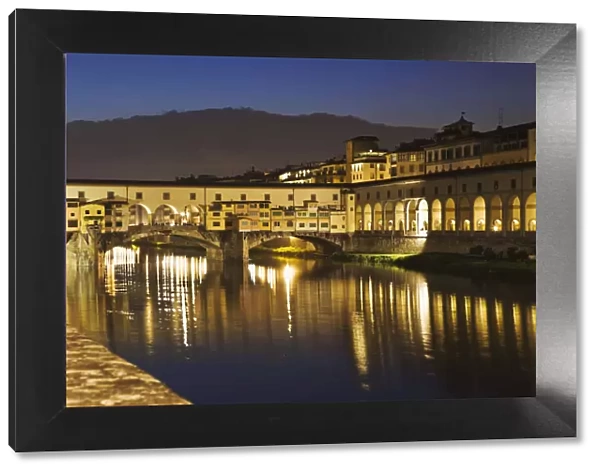 Europe, Italy, Florence. River Arno and the Ponte Vecchio at night