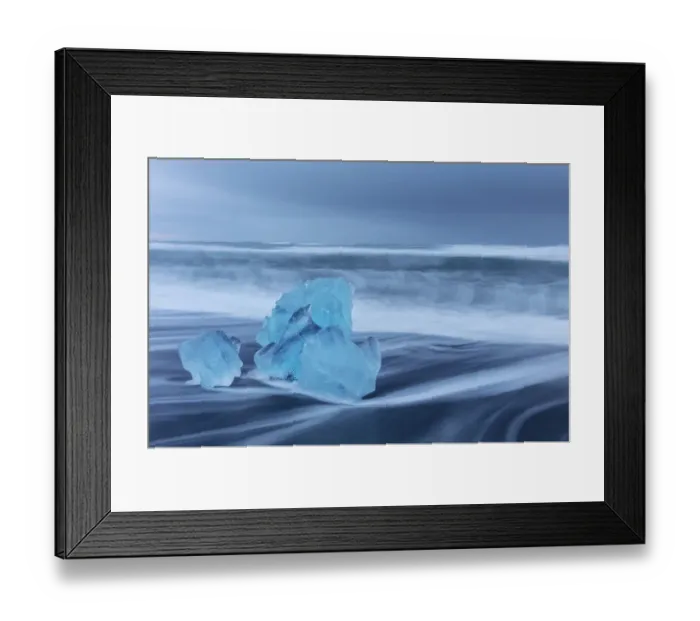 Framed Print : Diamond ice chards from calving icebergs on black sand beach at Jokulsarlon in south Framed Print : Diamond ice chards from calving icebergs on black sand beach at Jokulsarlon in south