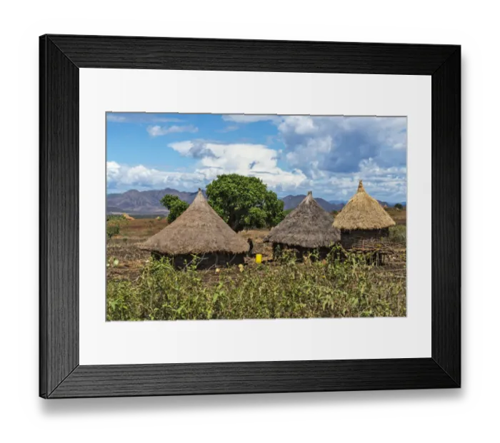 Framed Print : Traditional village houses with thatched roof with farmland in the mountain, Konso Framed Print : Traditional village houses with thatched roof with farmland in the mountain, Konso