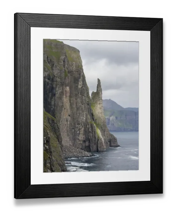 Framed Print : The landmark Trollkonufingur in the cliffs of the island of Vagar, part of the Faroe Islands Framed Print : The landmark Trollkonufingur in the cliffs of the island of Vagar, part of the Faroe Islands